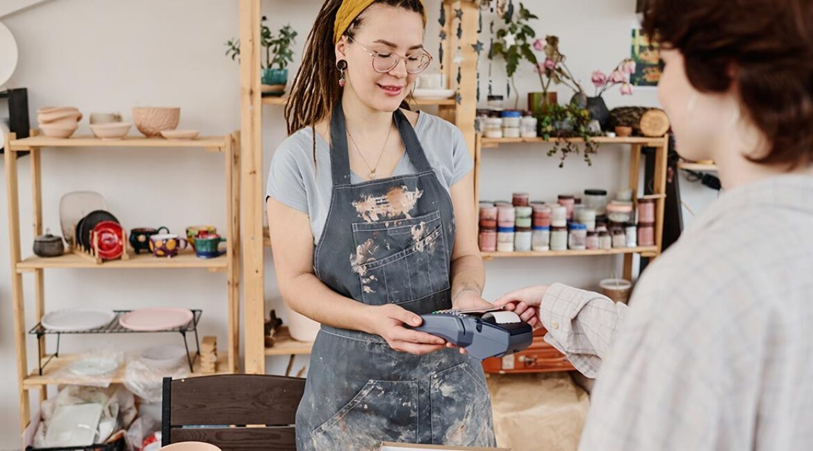 young-female-owner-of-small-earthenware-shop-selli-2025-03-13-10-34-22-utc