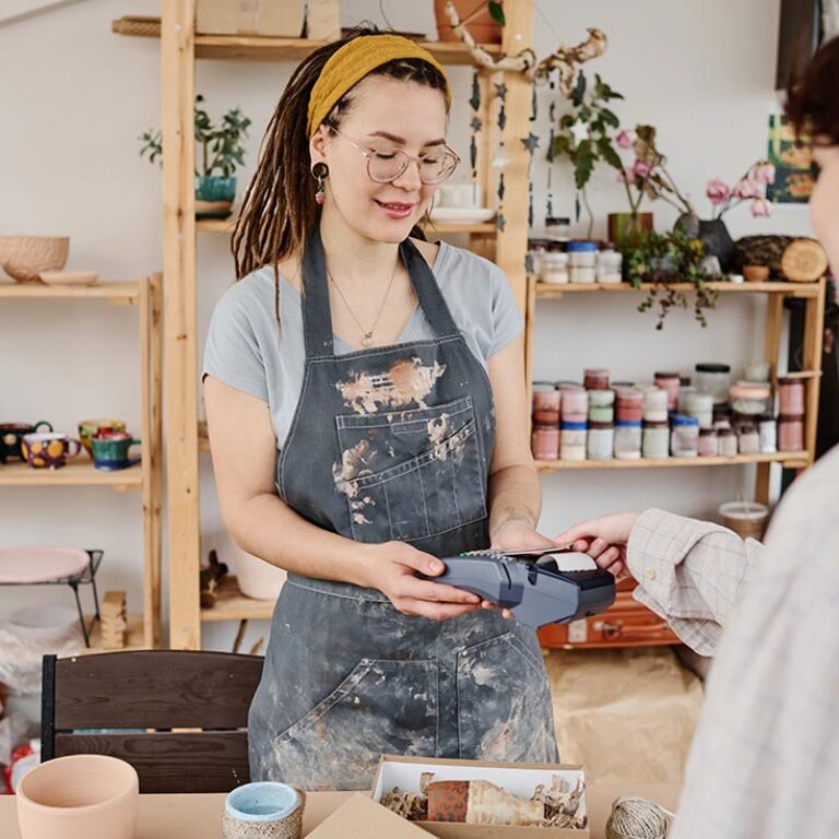 young-female-owner-of-small-earthenware-shop-selli-2025-03-13-10-34-22-utc